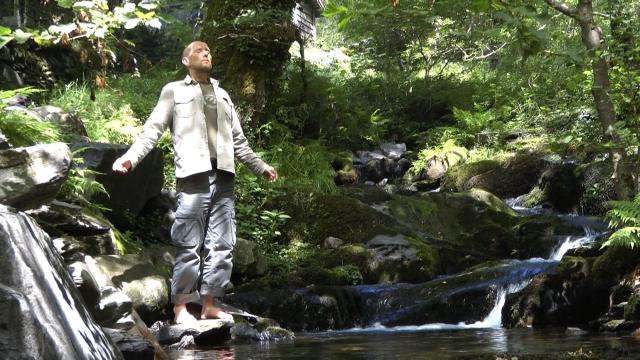 Transfiguration 2011 Chris on rocks by stream